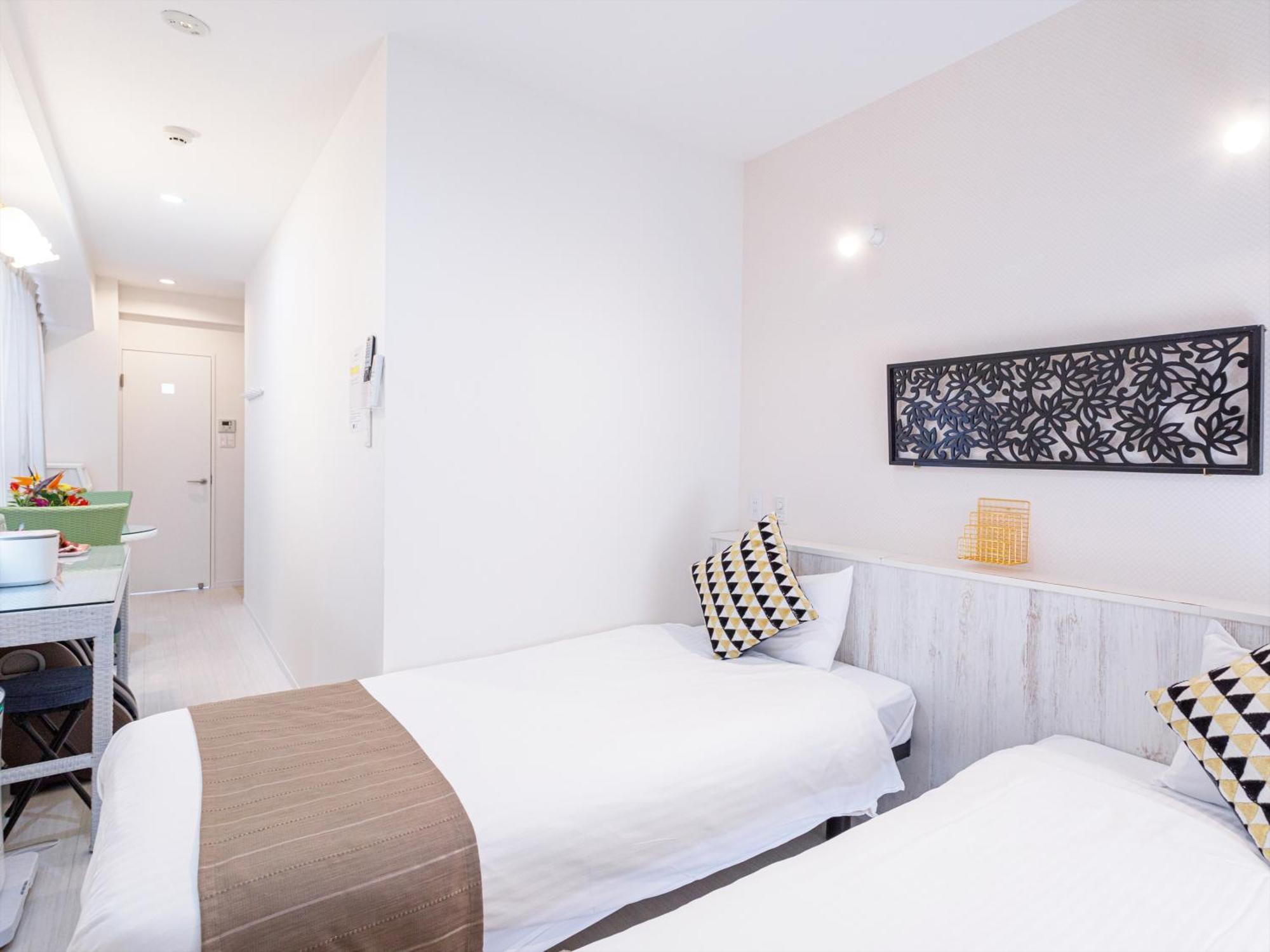 かりゆしコンドミニアムリゾート那覇スカイリビングホテル旭橋駅前 Naha Chambre photo